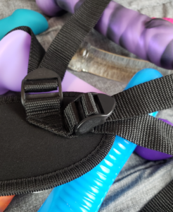 A close-up of where the harness straps are sewn into the neoprene backrest.