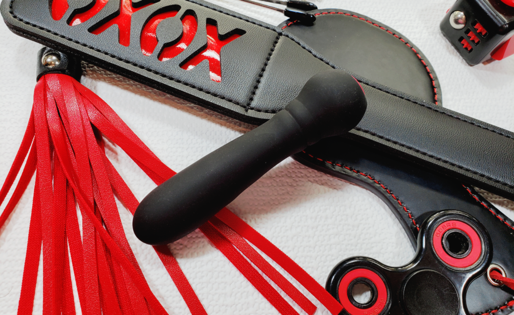 A close-up of the Ultra Bullet propped up against the XOXO Paddle.