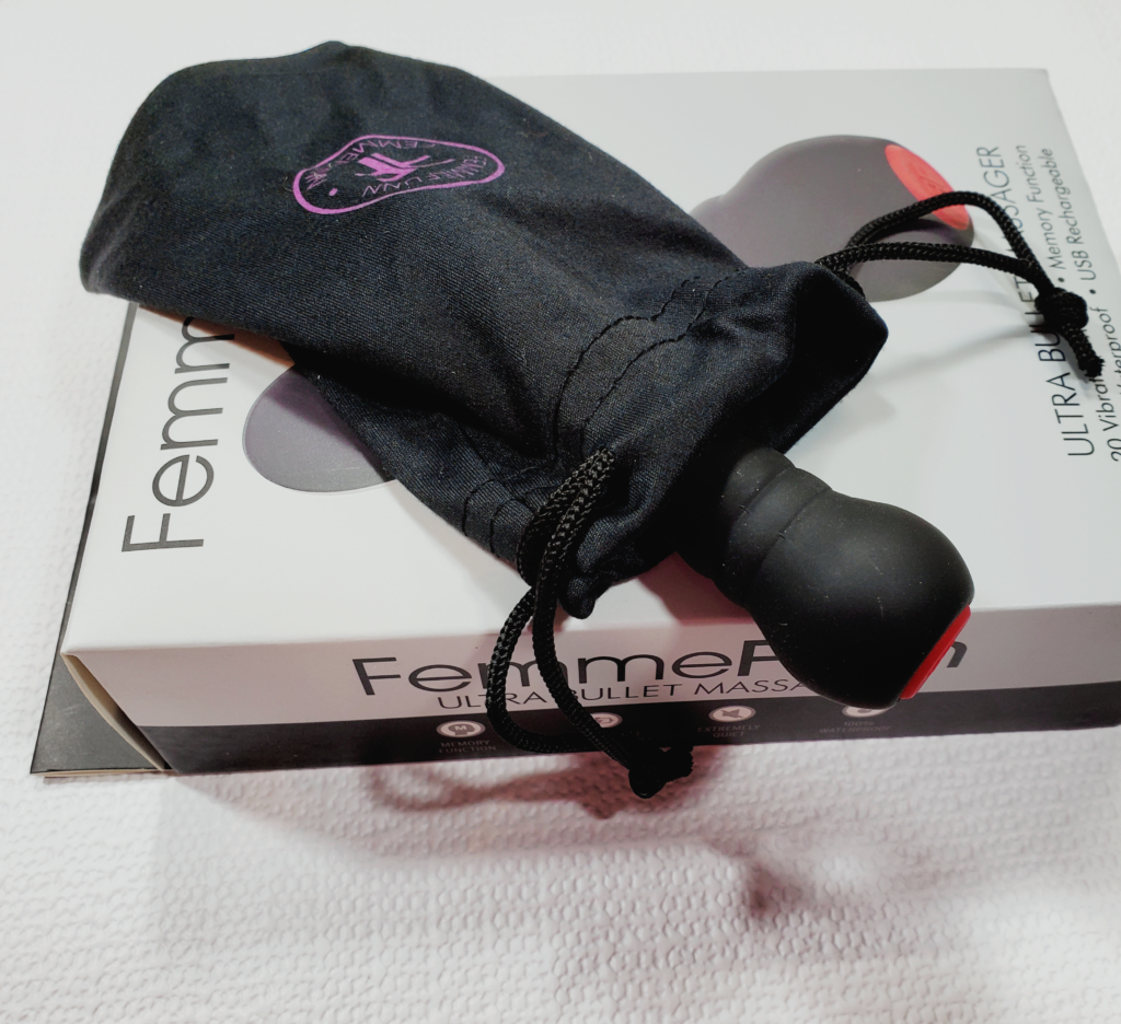 The Ultra Bullet laying across its box, tucked into a small pullstring bag with the FemmeFunn logo.
