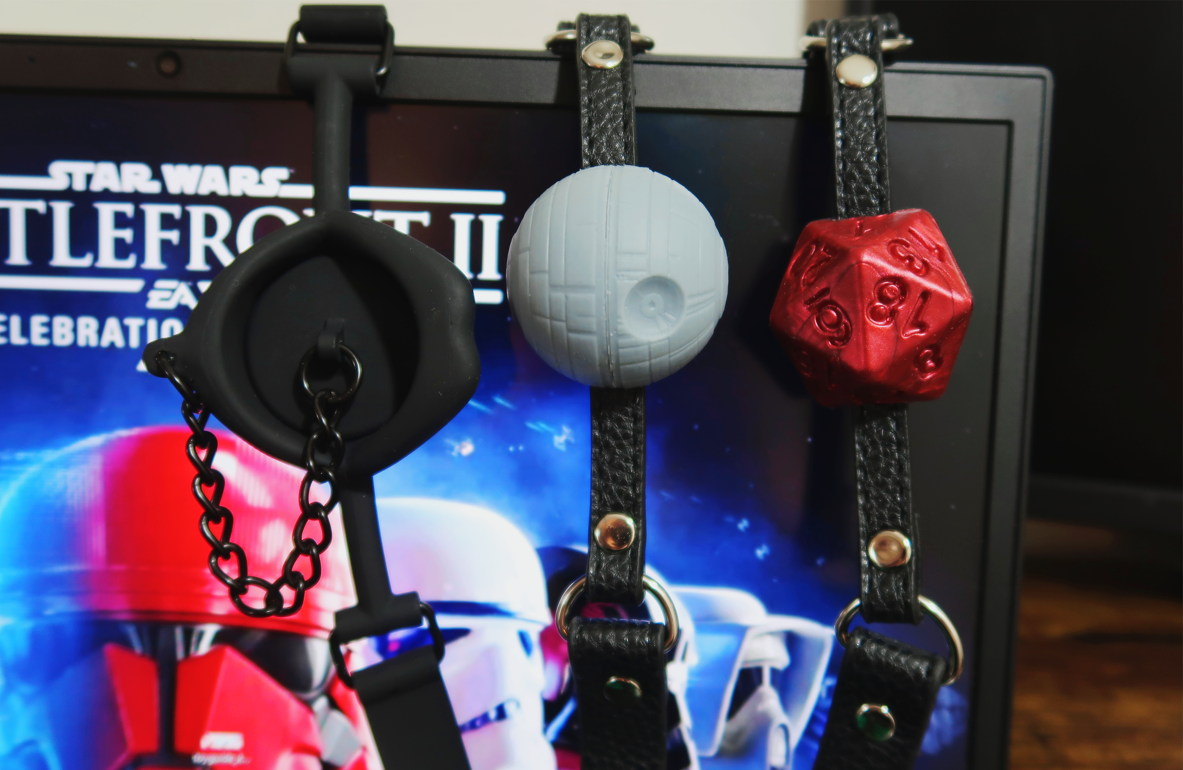A comparison between the Space Station Ball Gag and D20 Ball Gag.