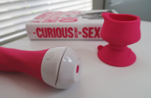 The Wall Banger Vibrator with its remote magnetically clicked to the base.