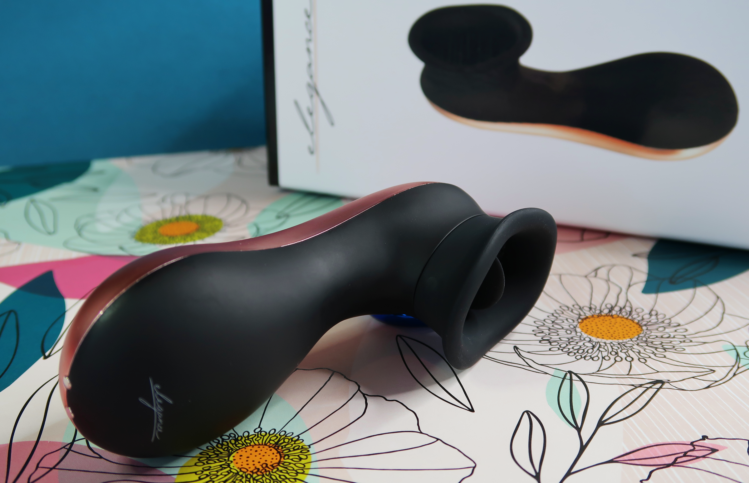 A sex toy that's shaped almost like a phone (not a cellphone) with a nozzle face that contains a small, flickable tab.