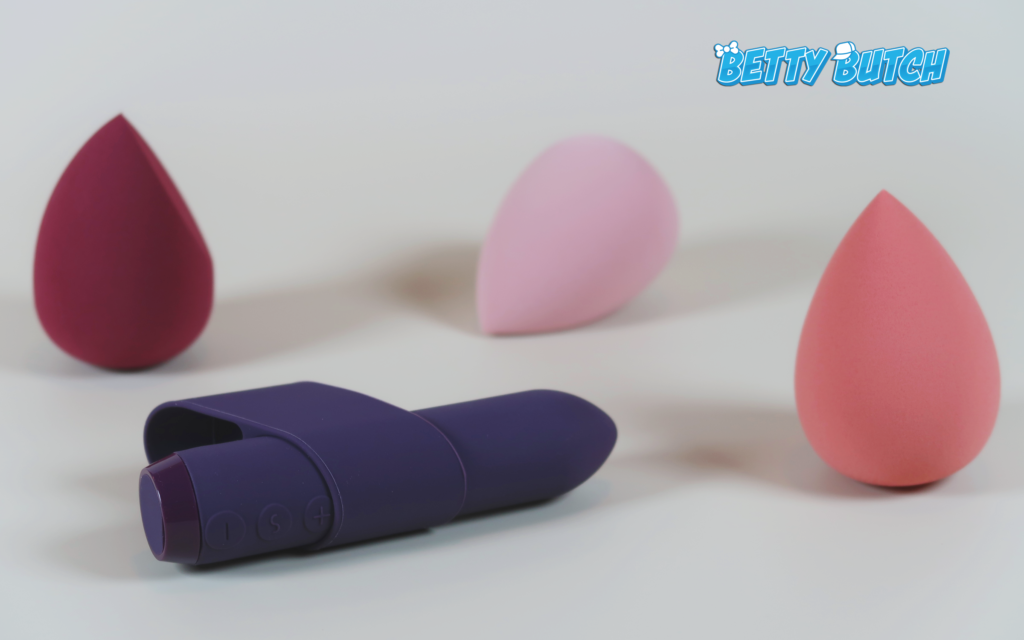 The Je Joue Silicone Classic Bullet With Ergonomic Finger Sleeve laying on its side.