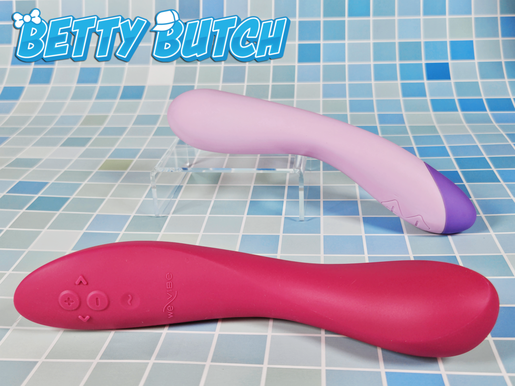 The We-Vibe Rave 2 Adjustable G-Spot Vibrator laying on its side in front of the Blush Wellness G Curve Vibrator.