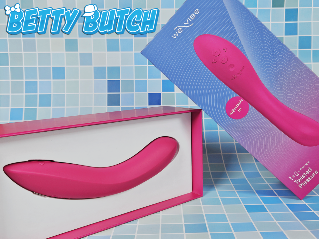 The We-Vibe rave 2 Adjustable G-Spot Vibrator inside its box with the lid turned to display the marketing.
